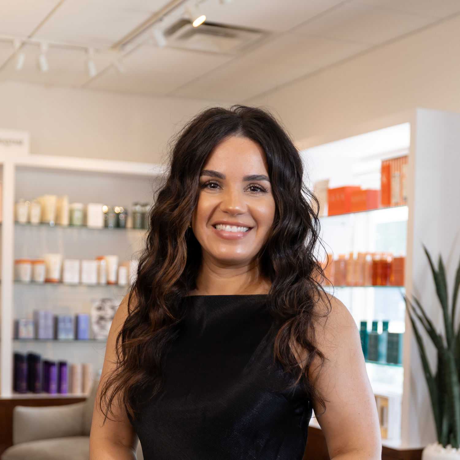 Portrait of Esmeralda, a professional stylist at Esmeralda’s Beauty Bar, showcasing their expertise and style.