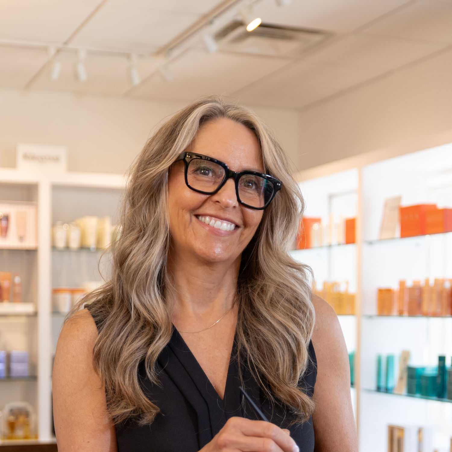 Portrait of Janet, a professional stylist at Esmeralda’s Beauty Bar, showcasing their expertise and style.